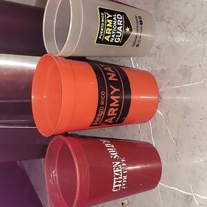 Three Army plastic cups